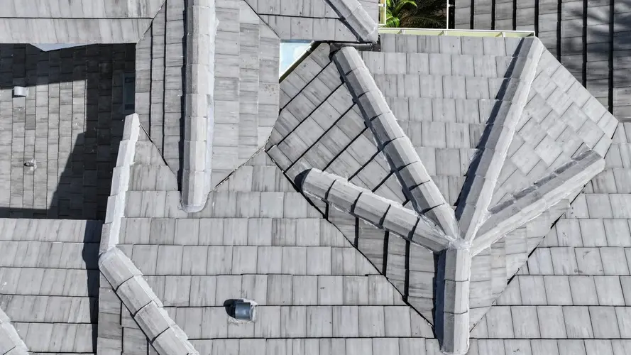 Melbourne Beach home with tile roof installed by DC Roofing Inc., local contractors specializing in coastal roofing solutions