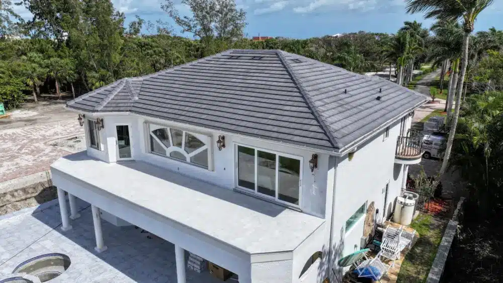 Restored Melbourne home with new metal roof after storm repair by DC Roofing Inc.